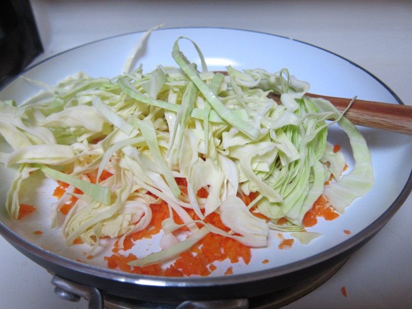 Cooking the cabbage and carrots 