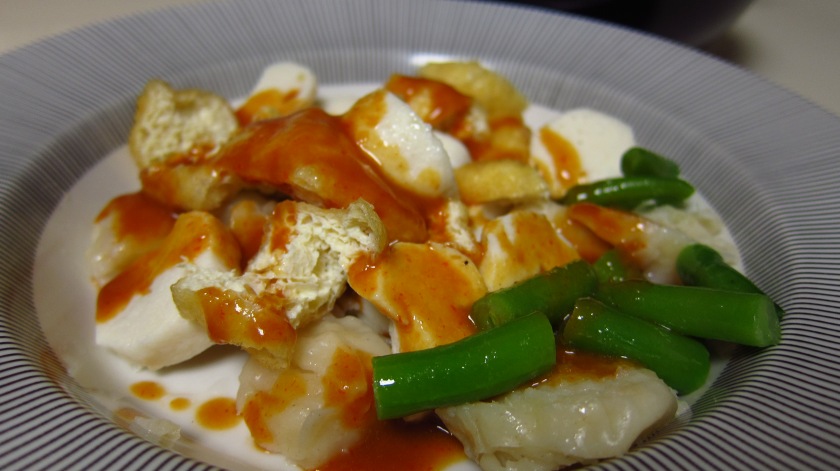 seafood dumplings, tofu, green beans in peanut sauce